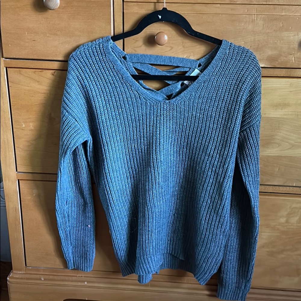 cute grey sweater crisis cross in back